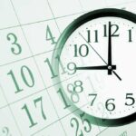 Hidden Calendar Tricks: Steal Back Hours! A clock overlaying a calendar, illustrating the concept of time management