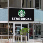Why Starbucks SLASHED Hours – 15,000 Betrayed Starbucks storefront with glass doors and logo