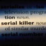 Serial Killer Fears Grip Houston Close-up of a dictionary page showing the definition of 'serial killer'