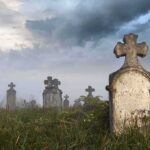 Chilling Discovery: Corpses Sold Online Like Collectibles Foggy graveyard with tombstones and crosses under a cloudy sky
