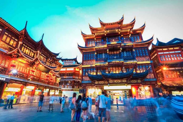 shutterstock_147718496.jpg Illuminated traditional Chinese buildings in a bustling urban area at night