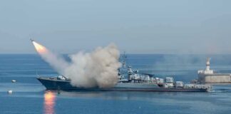 A military ship launching a missile into the ocean