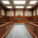 Navy Vet Funnels Crypto to ISIS? Empty courthouse courtroom with wooden benches and chairs.