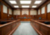 Citizenship Crackdown Escalates — Who’s Next? Empty courthouse courtroom with wooden benches and chairs.