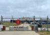 Navy Red Flags Ignored — Sailor Dead Chain-link fence with Restricted Area Stop No Photography sign.