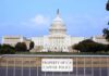 Democrats Rage As Iran Fight Halts View of the U.S. Capitol building with a security barrier in front