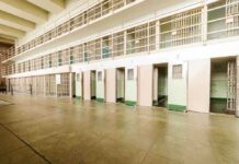 Congresswoman Targeted From Inside Government Interior view of a prison cell block with empty cells and security bars