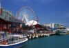 Navy Pier in Chicago with a ferris wheel and boats along the waterfront
