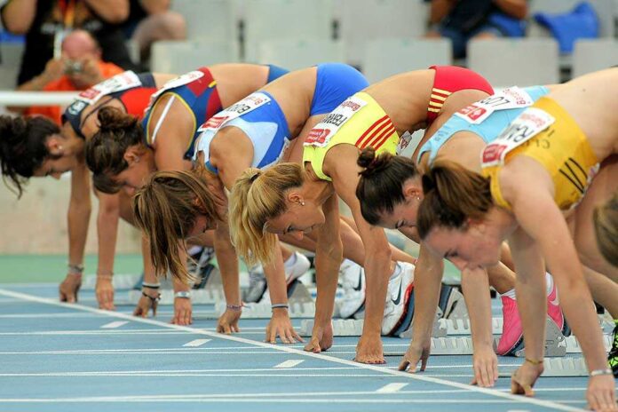 Barcelona,-,July,22:,Athletes,Ready,On,The,Start,Of Female athletes preparing to start a race in track and field
