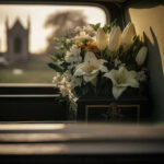 White flowers in a car with blurred background.