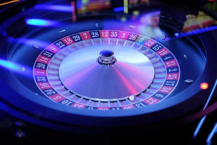 shutterstock_1024546591 Roulette wheel with ball resting on numbered track