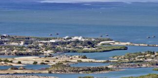 Aerial view of a coastal landscape featuring waterways and islands