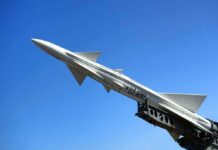 U.S. Army missile on launch rail against clear blue sky