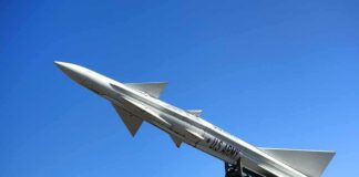 U.S. Army missile on launch rail against clear blue sky