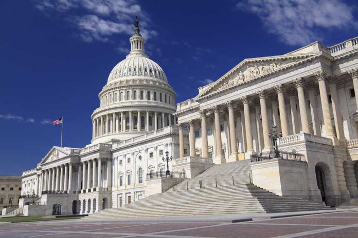 The U.S. Capitol building with its dome and columns under a blue sky