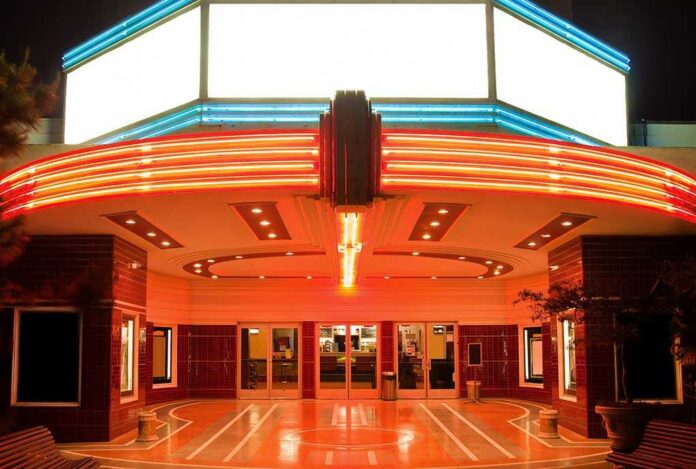 Tower,Theater,In,Sacramento,At,Night Entrance of a vintage movie theater illuminated by neon lights at night