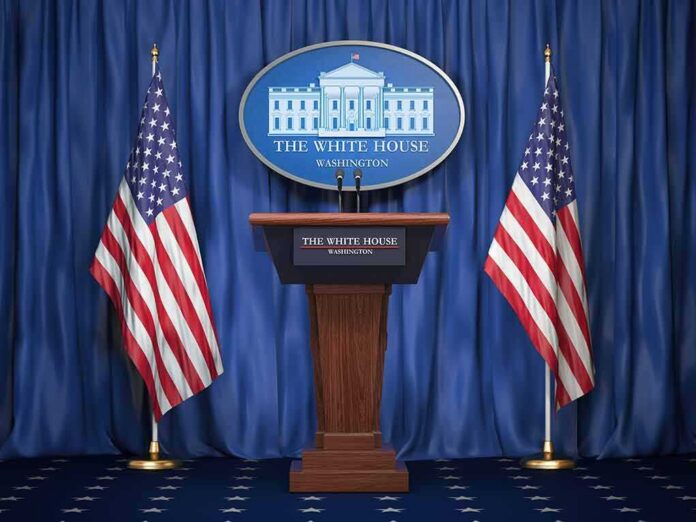 White House press podium with microphones and two American flags