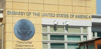 United States Embassy exterior with signage and seal