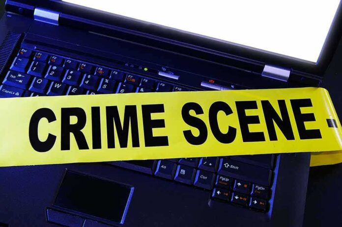 shutterstock_76567243 Laptop keyboard with yellow crime scene tape across it