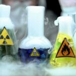 Biohazard Helpdesk? AI’s Unsettling New Skill laboratory flasks with hazard symbols and colorful liquids