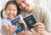 Judge Slams Wild Surrogacy Scheme Smiling child and adult holding passports