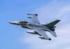 Fighter jet banking in the sky