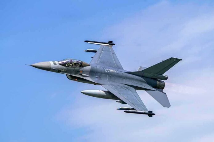 shutterstock_1629356173 Fighter jet banking in the sky
