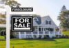 Ohio Suburb’s Wild Connection To Somalia’s Strongman for sale sign in front of suburban house