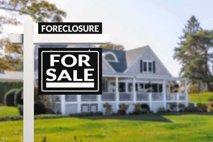 for sale sign in front of suburban house