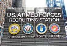 Marines Dangle $15K – Who Actually Qualifies? U.S. Armed Forces recruiting station facade with service emblems