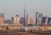 Aviation Crackdown: 27 Carriers on Ice Airplane taxiing on runway with city skyline in background