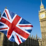 Union Jack flag with Elizabeth Tower in the background
