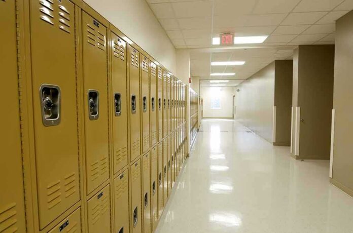 shutterstock_84230776 Row of yellow school lockers in an empty hallway