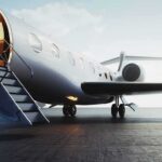 Election Loss – Then a Jet to Miami Private jet on tarmac with open door and boarding stairs