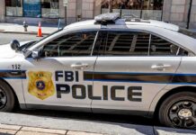 FBI Police patrol car parked on city street